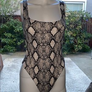 very cute and soft snakeskin bodysuit